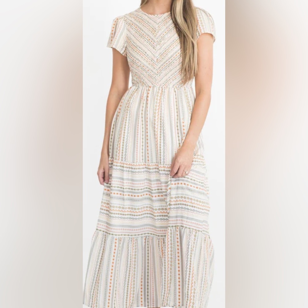 NWT striped pattern dress with a smocked bodice, maxi length, side pockets